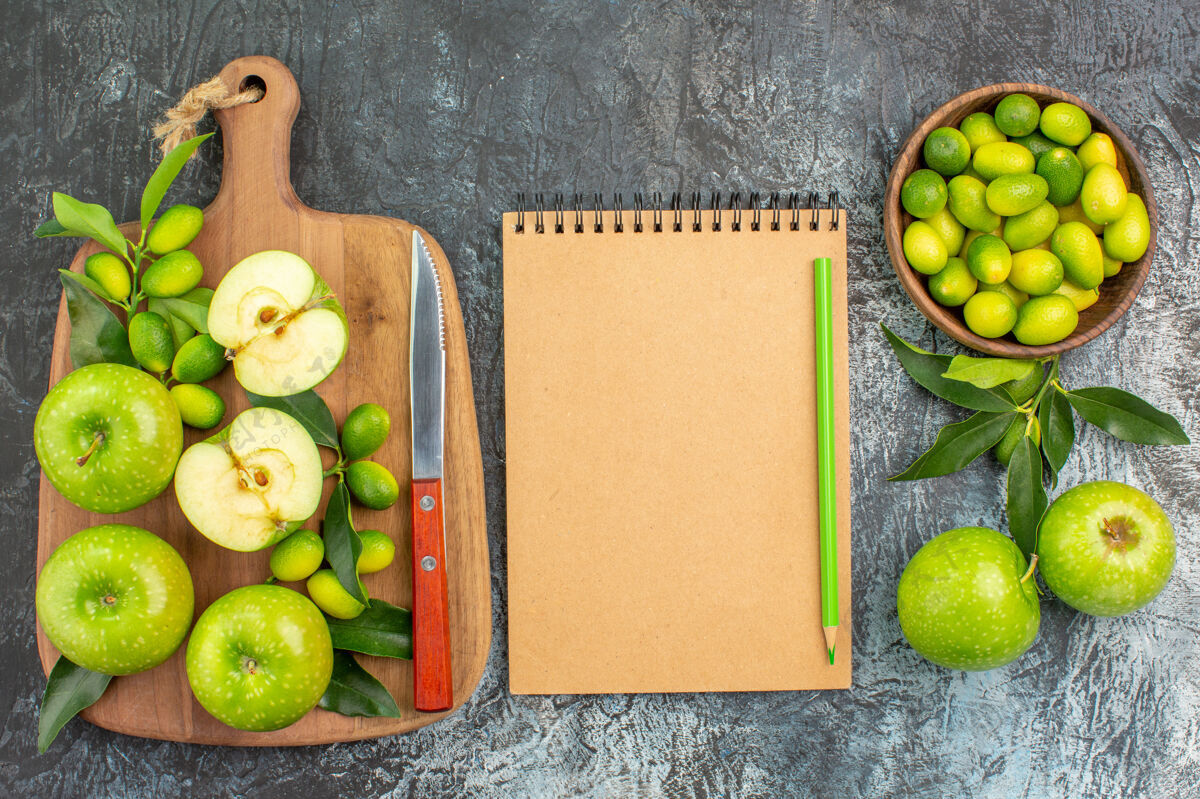 饮食顶部特写查看水果开胃苹果刀上板柑橘类水果笔记本铅笔可食用水果水果笔记本