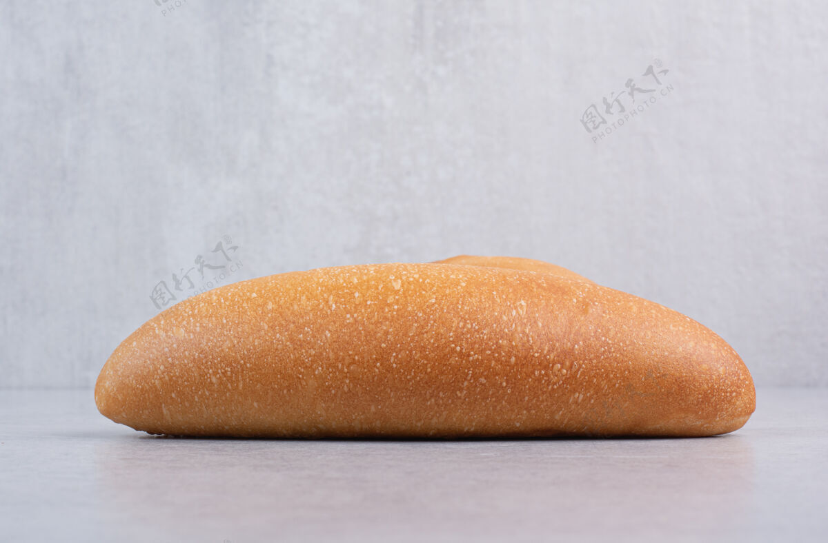 谷类石头背景上的新鲜面包高品质照片面包卷面包小麦